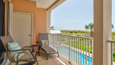 028 Grandma's Condo Covered Back Balcony with View of Pool and Beach