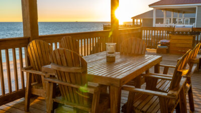 041 Still Waters Covered Back Deck Outdoor Dining at Sunset with Gulf View